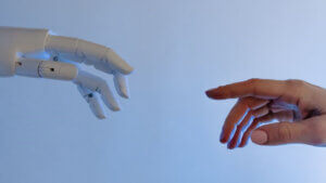 Human Hand And Robot Hand Almost Touching 300x169
