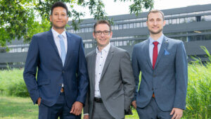 Three Men In Suits Smiling For Photo 300x169